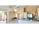 Open-concept kitchen features granite countertops, stainless steel appliances, and a breakfast nook at 14748 W Willow Ln, Surprise, AZ 85374