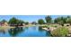 Pond view with a fountain and lush landscaping at 14748 W Willow Ln, Surprise, AZ 85374