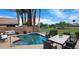 Backyard pool and outdoor dining area, perfect for relaxing and entertaining guests at 14748 W Willow Ln, Surprise, AZ 85374