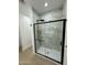 Contemporary bathroom showcasing a glass enclosed shower with marble-style tiling at 15864 S Cherry Hills Dr, Arizona City, AZ 85123