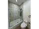 Tiled shower/tub combo in renovated bathroom at 15864 S Cherry Hills Dr, Arizona City, AZ 85123