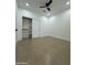 Bright bedroom with tile floors and closet at 15864 S Cherry Hills Dr, Arizona City, AZ 85123
