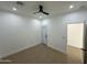 Bedroom with tile floors, fan and exterior access at 15864 S Cherry Hills Dr, Arizona City, AZ 85123