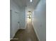 Hallway with tile floors leading to a kitchen at 15864 S Cherry Hills Dr, Arizona City, AZ 85123