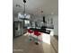 Spacious kitchen featuring stainless steel appliances, a center island with seating, and modern light fixtures at 15864 S Cherry Hills Dr, Arizona City, AZ 85123