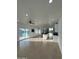 Open-concept living space featuring tile flooring, a kitchen island, recessed lighting, and natural light at 15864 S Cherry Hills Dr, Arizona City, AZ 85123
