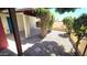 Inviting courtyard area with shaded seating, vine-covered posts, and beautiful landscaping at 1846 E Intrepid Ave, Mesa, AZ 85204