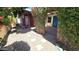 Charming courtyard with rock landscaping, stepping stones, and vine-covered posts at 1846 E Intrepid Ave, Mesa, AZ 85204