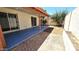 Spacious covered patio with access to the backyard, ideal for enjoying the outdoors at 1846 E Intrepid Ave, Mesa, AZ 85204