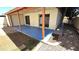 Relaxing covered patio with a blue concrete floor, perfect for outdoor entertaining and relaxation at 1846 E Intrepid Ave, Mesa, AZ 85204