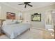 View of the main bedroom featuring neutral color scheme, a ceiling fan, and views to the outside at 20084 N 103Rd St, Scottsdale, AZ 85255