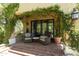 Covered outdoor area with brick floors, patio furniture, and climbing vines at 20084 N 103Rd St, Scottsdale, AZ 85255