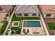 Aerial view of a backyard with a pool, spa, outdoor seating, and well-manicured landscaping providing a private oasis at 22849 E Marsh Rd, Queen Creek, AZ 85142