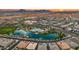 Beautiful aerial view of the lake, community pool, clubhouse and Arizona scenery at 22849 E Marsh Rd, Queen Creek, AZ 85142