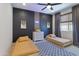 Shared bedroom features twin beds, a geometric rug, cool decor, and a ceiling fan with light at 22849 E Marsh Rd, Queen Creek, AZ 85142