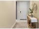 Inviting entryway featuring a decorative table with a table runner and a charming basket collection below at 22849 E Marsh Rd, Queen Creek, AZ 85142
