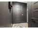 Hallway features stylish decor, designer-selected accent wall, and easy access to adjacent rooms at 22849 E Marsh Rd, Queen Creek, AZ 85142