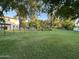 A spacious backyard, full of grass, perfect for activities at 2311 E Colter St, Phoenix, AZ 85016