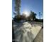Private basketball court on a sunny day, offering ample space for sports and recreation at 2311 E Colter St, Phoenix, AZ 85016