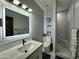 Modern bathroom featuring a stand up shower and an LED mirror at 2311 E Colter St, Phoenix, AZ 85016