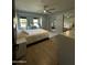 Inviting bedroom with natural light, a ceiling fan, and a sliding glass door closet at 2311 E Colter St, Phoenix, AZ 85016
