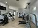 Wide open gym with wood floors and lots of machines at 2311 E Colter St, Phoenix, AZ 85016