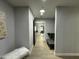 Hallway leading to the gym with a bench and a futon at 2311 E Colter St, Phoenix, AZ 85016
