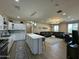 Well-lit kitchen featuring a central island, modern appliances, and an open floor plan at 2311 E Colter St, Phoenix, AZ 85016