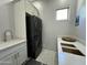 The laundry room features a gray countertop, stacked washer/dryer, and ample storage at 2311 E Colter St, Phoenix, AZ 85016