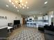 Spacious living room with an open kitchen and a dining area; features modern decor at 2311 E Colter St, Phoenix, AZ 85016
