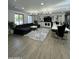 Expansive living room with a large sectional sofa, a dining table, and custom built-ins at 2311 E Colter St, Phoenix, AZ 85016
