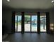 Living room with sliding glass doors showcases the beautiful pool and outdoor space at 2311 E Colter St, Phoenix, AZ 85016