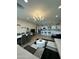 Open-concept living space with a modern kitchen, dining area, and comfortable seating, perfect for entertaining at 2311 E Colter St, Phoenix, AZ 85016
