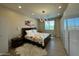 Comfortable main bedroom featuring modern decor, a large bed, and ample closet space at 2311 E Colter St, Phoenix, AZ 85016