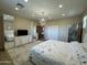 Spacious main bedroom features modern lighting, a large mirror, and multiple closets at 2311 E Colter St, Phoenix, AZ 85016