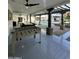 Outdoor entertainment space featuring a foosball table, pool table, and a view of the sparkling pool at 2311 E Colter St, Phoenix, AZ 85016