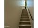 Bright staircase with a contemporary handrail leads to the upper level of the home at 2311 E Colter St, Phoenix, AZ 85016