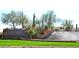 Landscaped entrance to Anthem by Del Webb with green lawn and water feature at 3549 W Magellan Dr, Anthem, AZ 85086