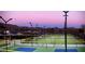 Outdoor pickleball courts illuminated by lights with mountain views in background at 3549 W Magellan Dr, Anthem, AZ 85086
