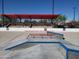 Skate park featuring ramps, rails, and a spectator area under a clear blue sky at 3549 W Magellan Dr, Anthem, AZ 85086