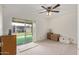 Bright bedroom with a sliding glass door to a patio at 4501 E Carol Ave # 48, Mesa, AZ 85206