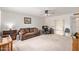 Comfortable living room with neutral carpet, ceiling fan, and plenty of natural light at 4501 E Carol Ave # 48, Mesa, AZ 85206