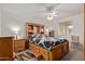Comfortable main bedroom with built-in storage and a ceiling fan at 4501 E Carol Ave # 48, Mesa, AZ 85206