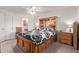 Main bedroom with a decorative quilt, built-in storage, and ceiling fan at 4501 E Carol Ave # 48, Mesa, AZ 85206