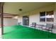 A covered patio featuring artificial grass and outdoor seating with a view at 4501 E Carol Ave # 48, Mesa, AZ 85206