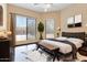 Modern bedroom with large windows, wood floors, and sleek furnishings at 6088 E Knolls N Way, Cave Creek, AZ 85331
