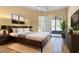 Cozy bedroom with a sleek bed, dark furniture and ample natural light at 6088 E Knolls N Way, Cave Creek, AZ 85331