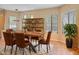 Inviting dining room with wood table, leather chairs and display shelving at 6088 E Knolls N Way, Cave Creek, AZ 85331