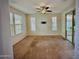 Bright bedroom with ample natural light, ceiling fan, and access to a private balcony at 17749 W Woodrow Ln, Surprise, AZ 85388