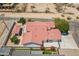 An aerial view of a single-Gathering home with red tile roof, spacious backyard, and attached garage at 2701 E Caldwell St, Phoenix, AZ 85042